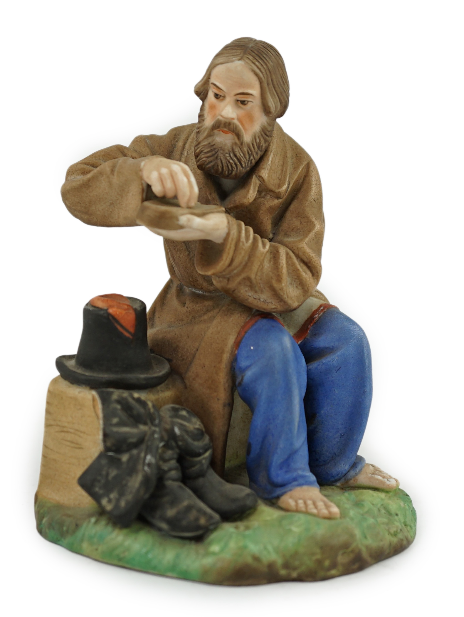 A Russian Gardner factory coloured biscuit porcelain figure of a man salting bread, late 19th century